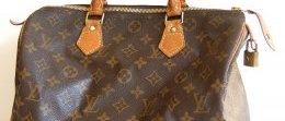 Louis Vuitton bag with polished metal hardware